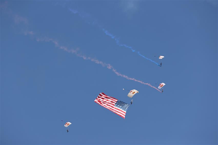 skydivers with giant USA flag